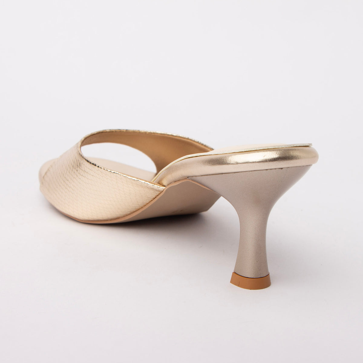 Gold snake print kitten heel mules for women, one wide light-gold snake-embossed band crosses the vamp and is edged in smooth mirror-gold binding that also wraps the topline and platform rim, over a cream footbed and a matte champagne flared hourglass kitten heel capped with a natural tan tip