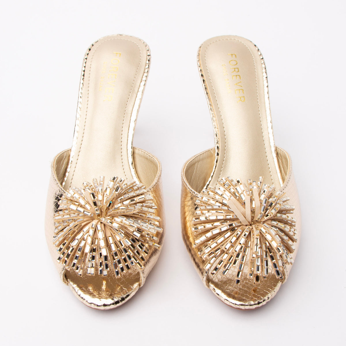 Gold mules for women, both shoes from the front