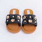 Black ruched ballet flats styled for everyday casual wear