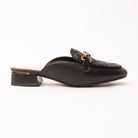 Black quilted loafer mules for women, a matte black loafer mule with a diamond-quilted apron over the vamp, a slim keeper strap carrying a polished gold snaffle bar, and a low block heel wrapped with a gold plate above a cream-nude footbed