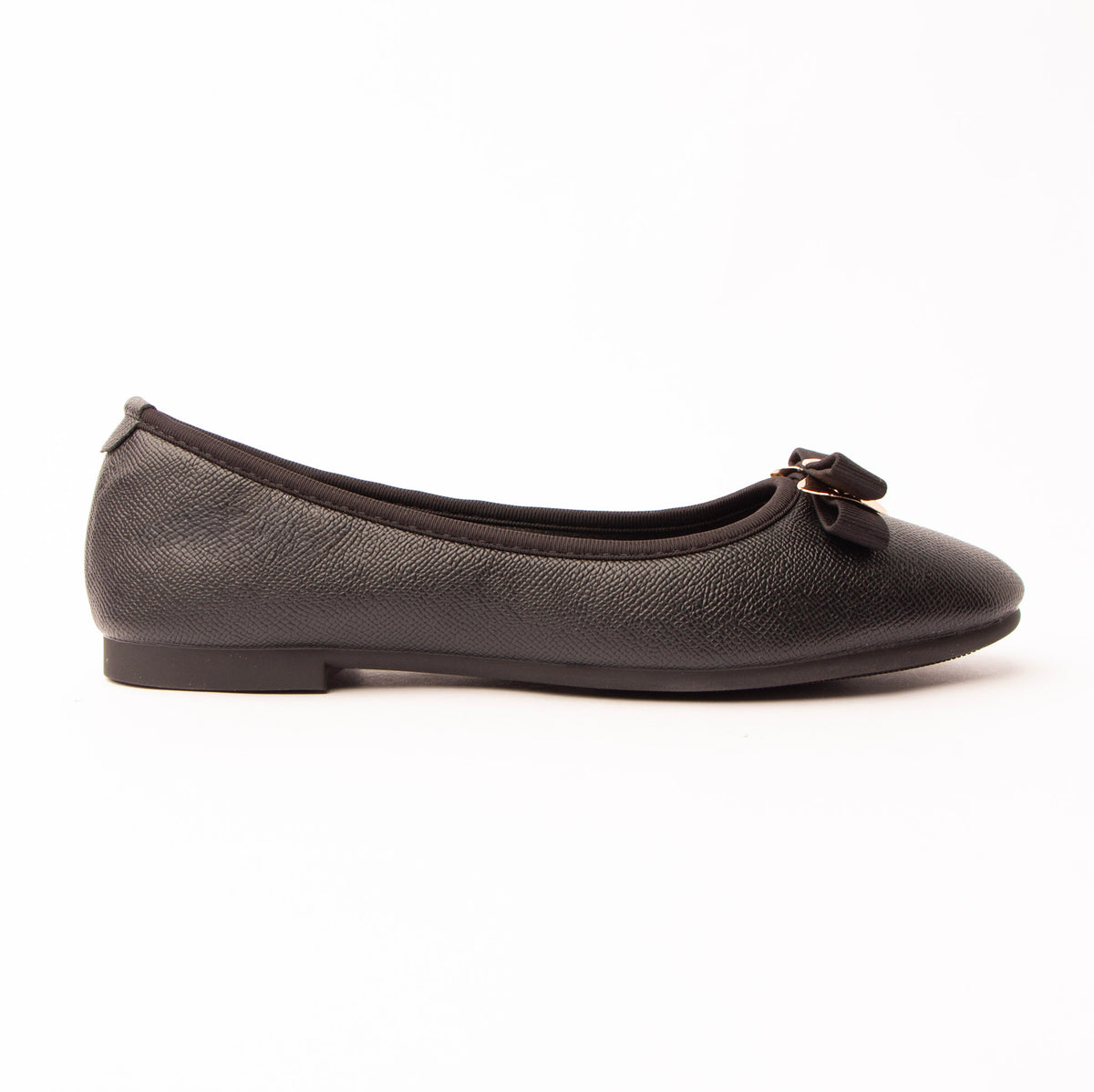 Black bow ballerina flats for women, a black ballerina flat with a pebbled saffiano-style grain and glossy topline binding, carrying a flat black grosgrain bow gathered by a polished gold bar