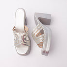 Silver beaded platform mules for women, a bright silver metallic upper whose looping vamp bands are picked out in clear crystals against pale nude mesh for a high-contrast finish, over a silver footbed and a silver-wrapped platform with a broad squared block heel