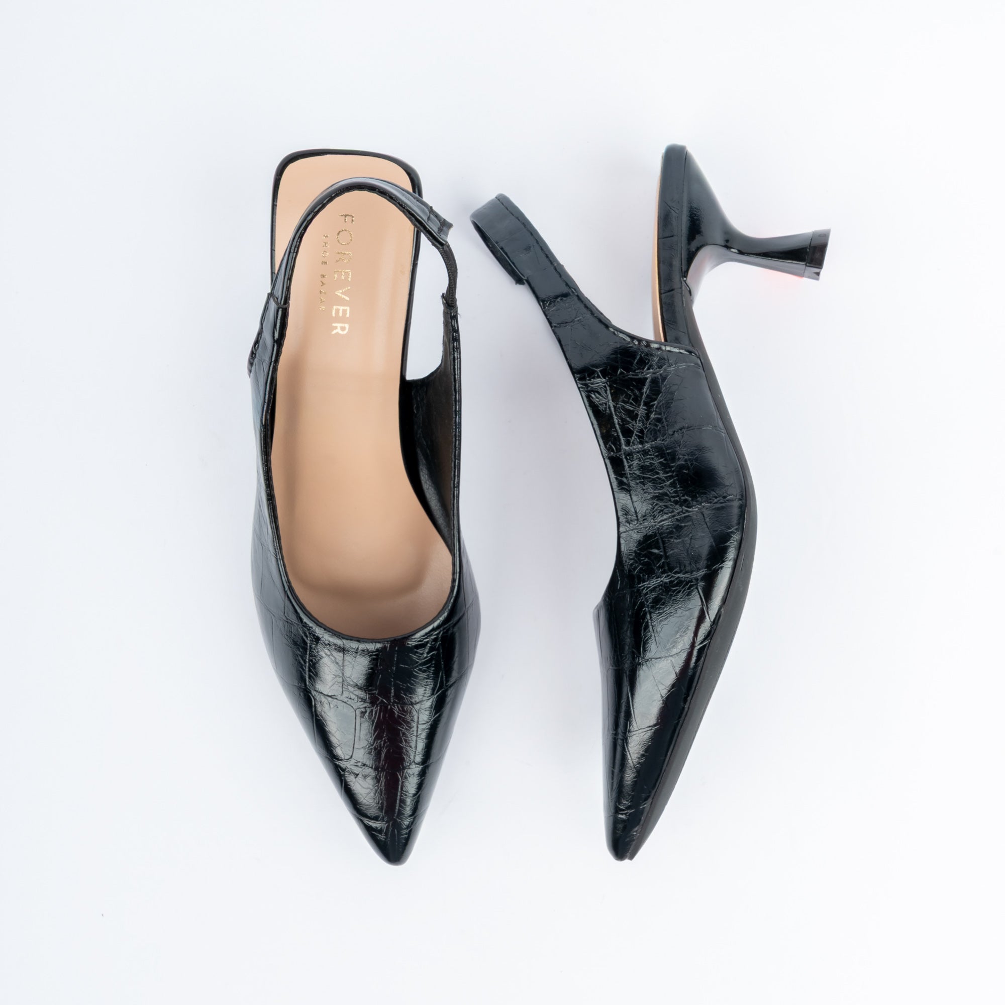 Black pumps for women, a croc-embossed glossy upper drawn to a long sharp point, with a slingback strap and a flared spool heel in the same croc finish