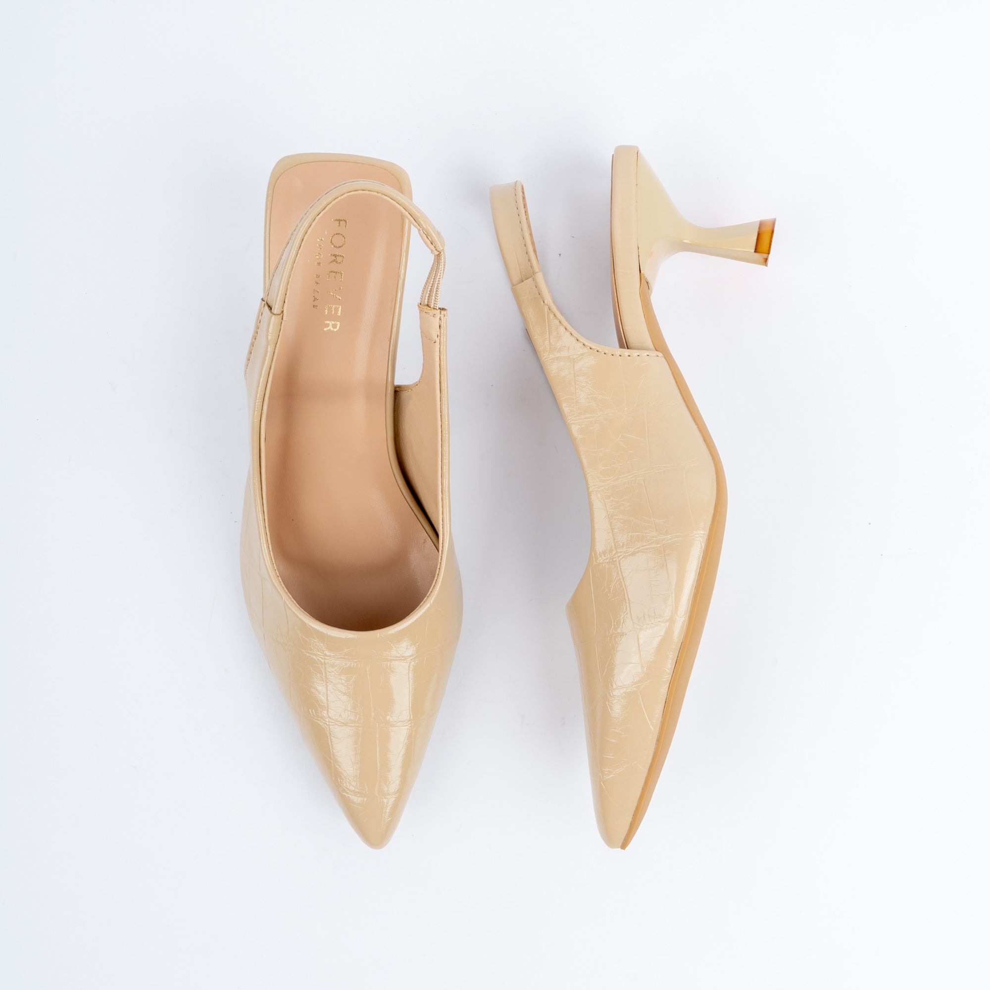 Beige pumps for women, a glossy croc-embossed upper with a low-cut V vamp tapering to a long pointed toe, held by a slim elasticated slingback, on a slender flared spool heel