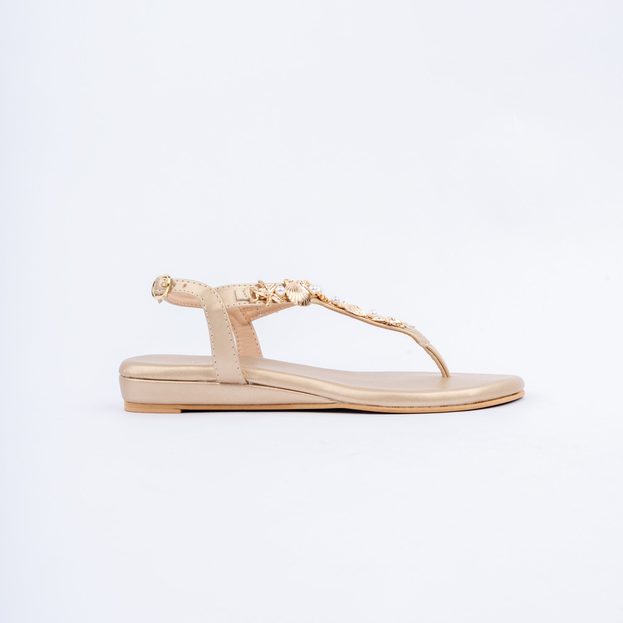 Gold flat sandals for women with cushioned footbed, side view