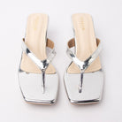 Silver toe-post kitten heel mules for women, both shoes from the front