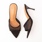 Black mules for women, both shoes laid flat