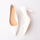 White folded strap pumps for women with a cushioned footbed