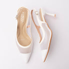 White pumps for women, both shoes laid flat