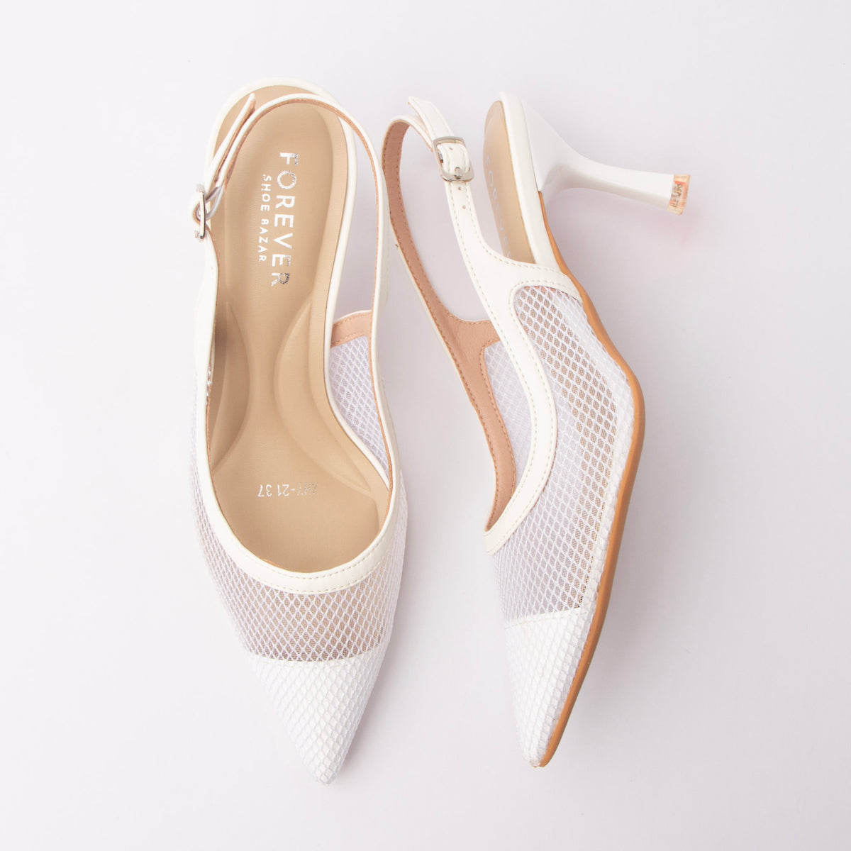 White pumps for women, both shoes laid flat