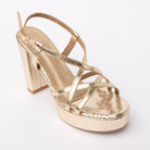 Gold block heel sandals styled for casual wear