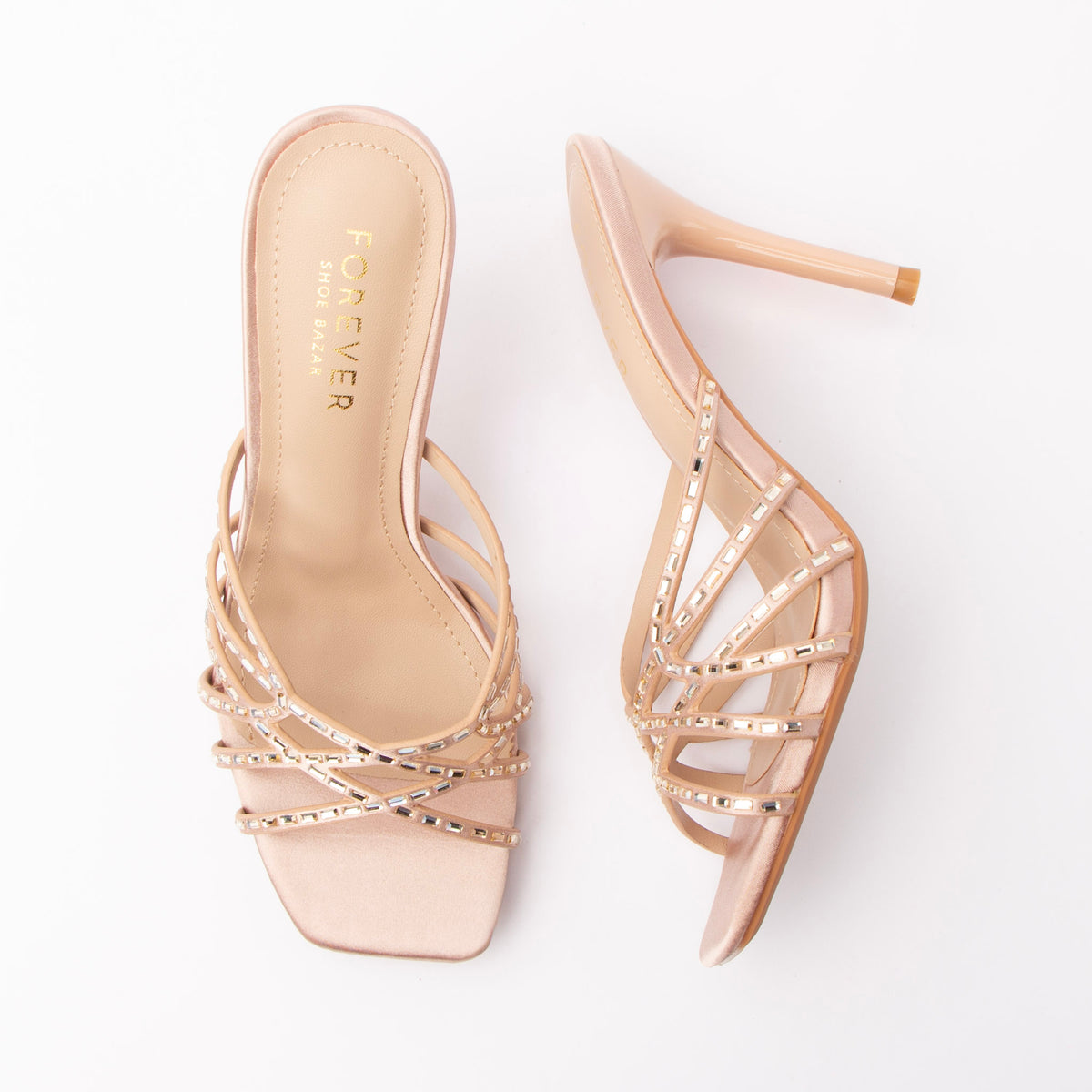 Nude mules for women, both shoes laid flat