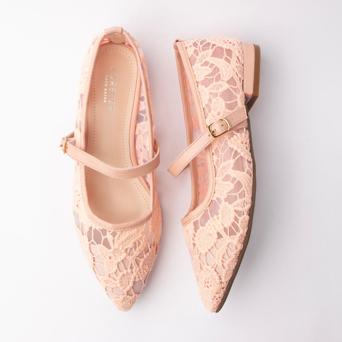 Pink Mary Janes for women, both shoes laid flat