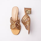Copper block heel mules for women, interlocking looped bands of crystal studs set over sheer mesh cut-outs, on a metallic footbed with a polished gold plate inset at the outer face of the squared block heel