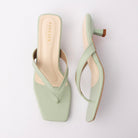 Green toe-post kitten heel mules for women, both shoes laid flat