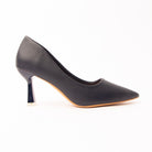 The Sculpted - Navy Blue Casual Heel, a one-piece inky navy pebble-grain upper running seamless from a long tapered point to a closed heel, on a slender flared heel capped in polished silver