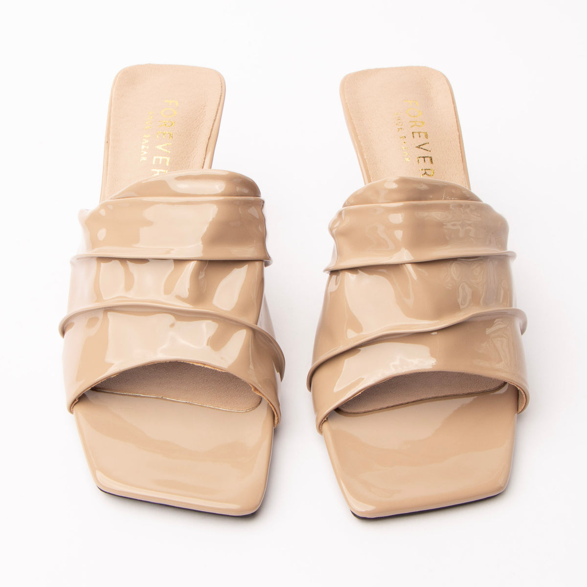Khaki patent mules styled for everyday wear