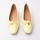 Yellow pumps for women, both shoes from the front