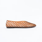 Coffee brown jelly flats for women, a translucent amber jelly upper moulded into an all-over diamond lattice cage wrapping the closed toe and heel counter, over a chocolate-brown branded footbed