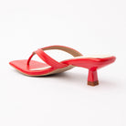 Red toe-post kitten heel mules for women, back view showing the heel
