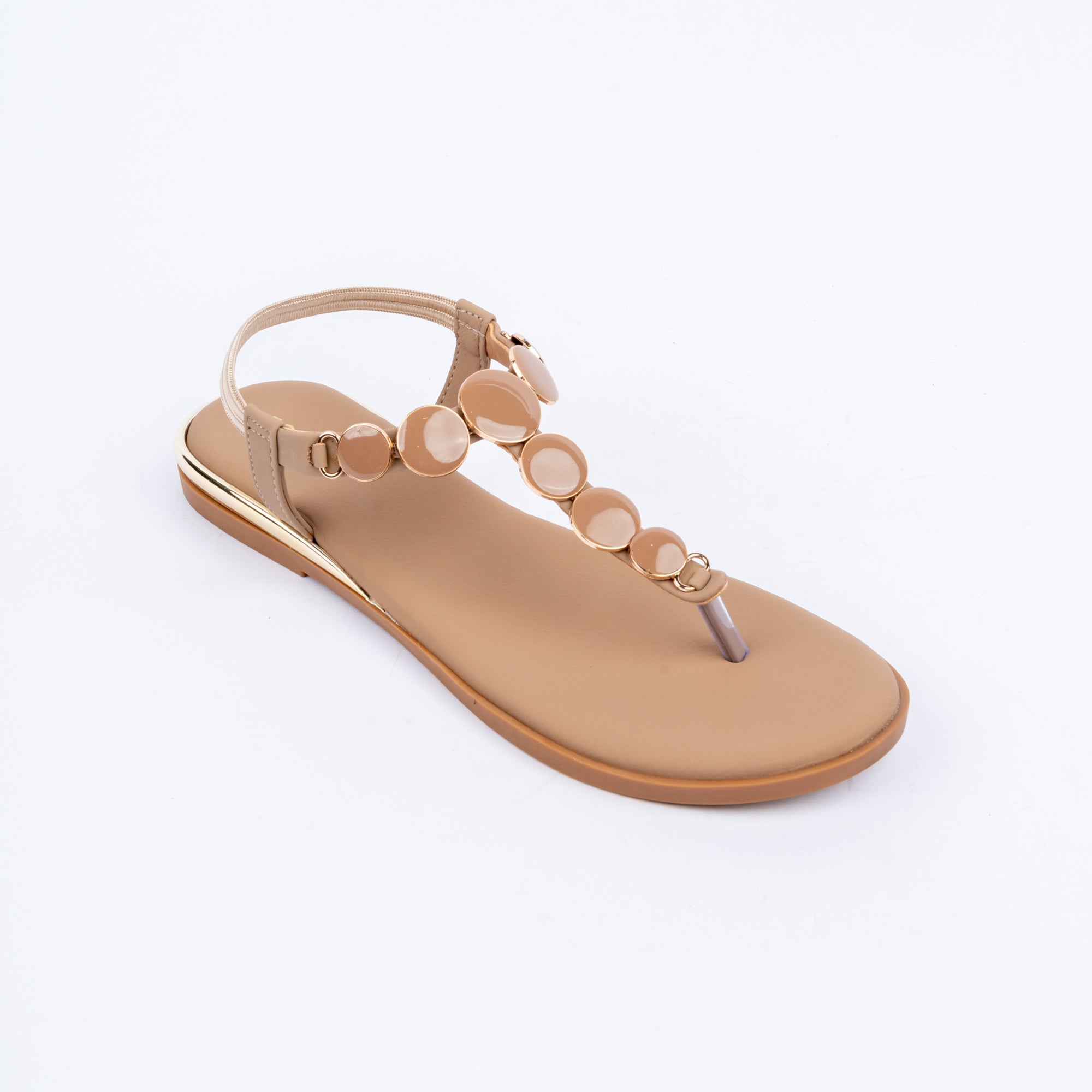 Beige flat sandals styled for casual wear
