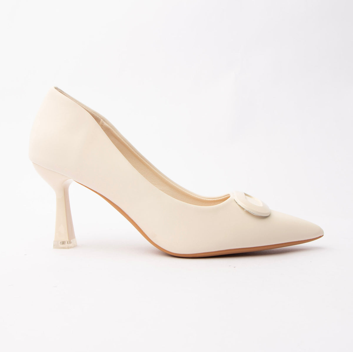 Beige buckle court shoes for women, a seam-free ivory-cream court in smooth matte faux leather with a softly scalloped topline, broken only by a broad squared tonal buckle plaque on the vamp, above a slender flared hourglass heel tipped in pale silver