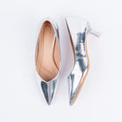 Silver pumps for women, a mirror-finish patent upper with a bare low-cut throat line and a flared kitten heel tipped in clear acrylic