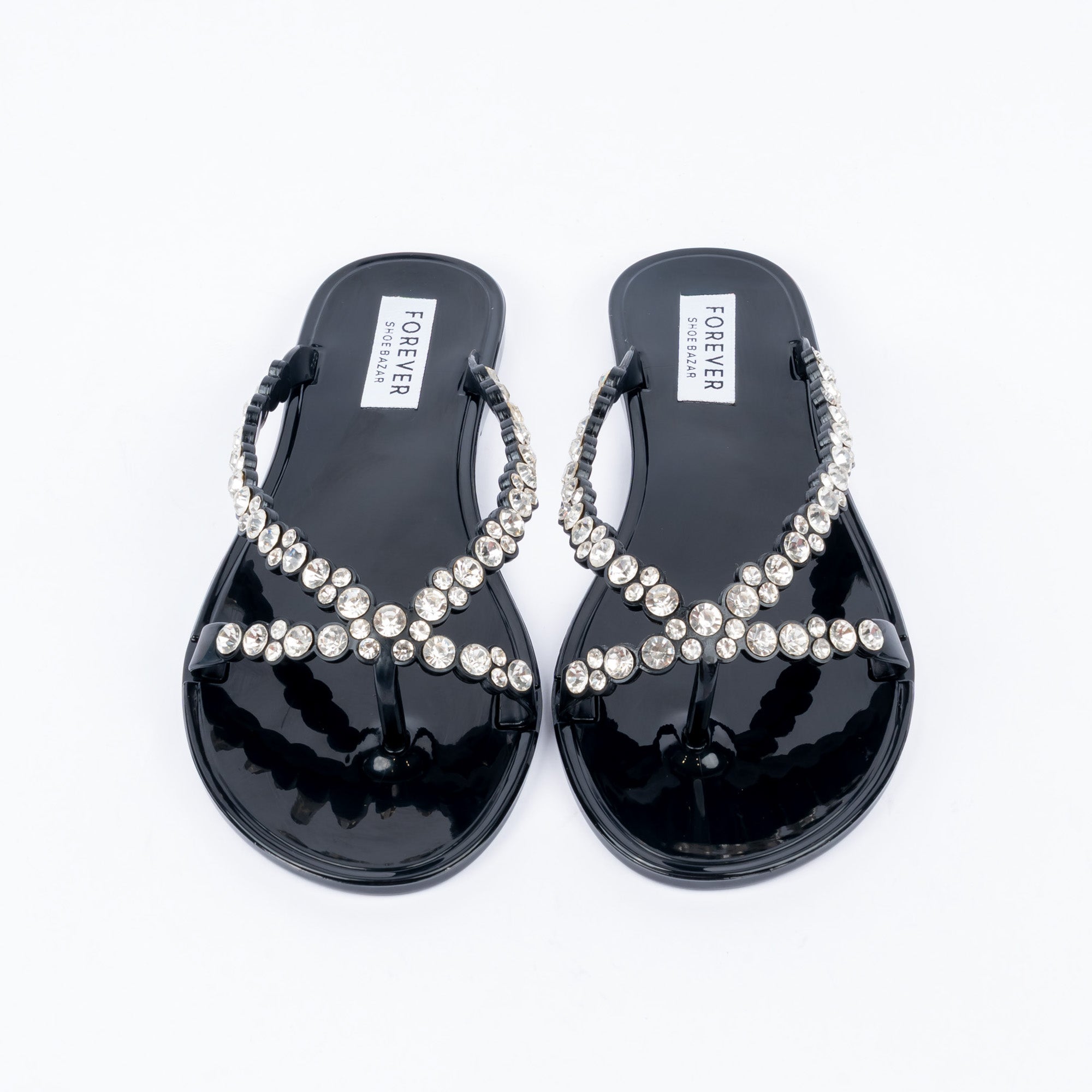 Black flat sandals styled for casual wear