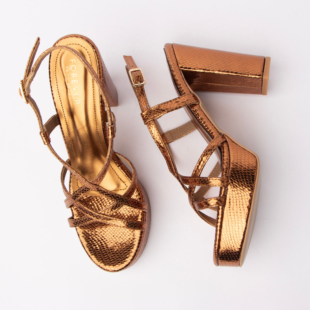 Copper block heel sandals for women, caged snake-embossed straps forming a slim T-bar over the vamp, a pin-buckle ankle strap in gold-tone hardware, and a covered chunky block heel lifted by a matching wrapped platform