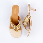 Gold slim heel mules for women, a chevron-beaded panel narrowing to a slim toe post
