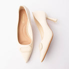 Beige buckle court shoes for women with a cushioned footbed