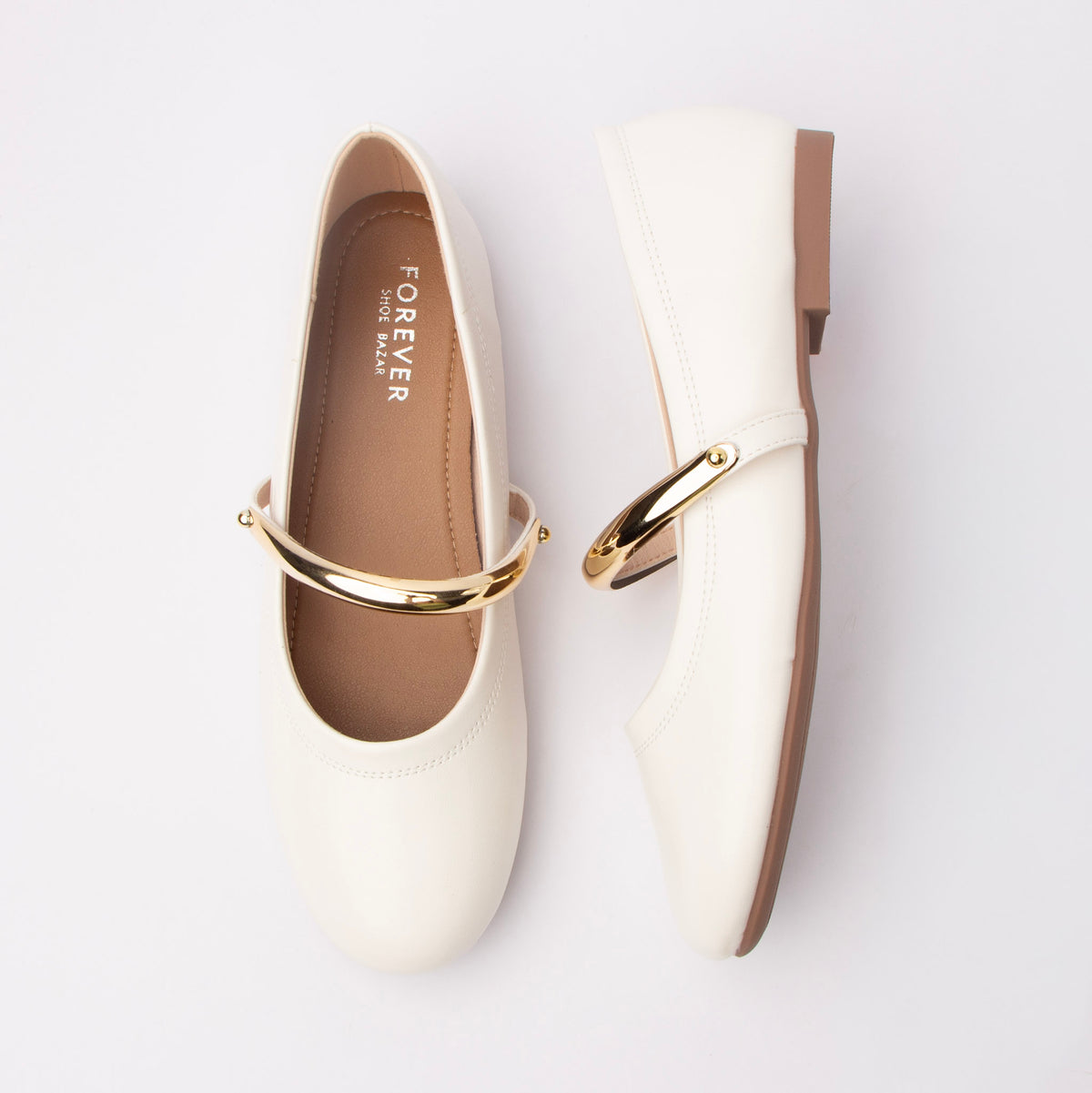 White flats for women, both shoes laid flat