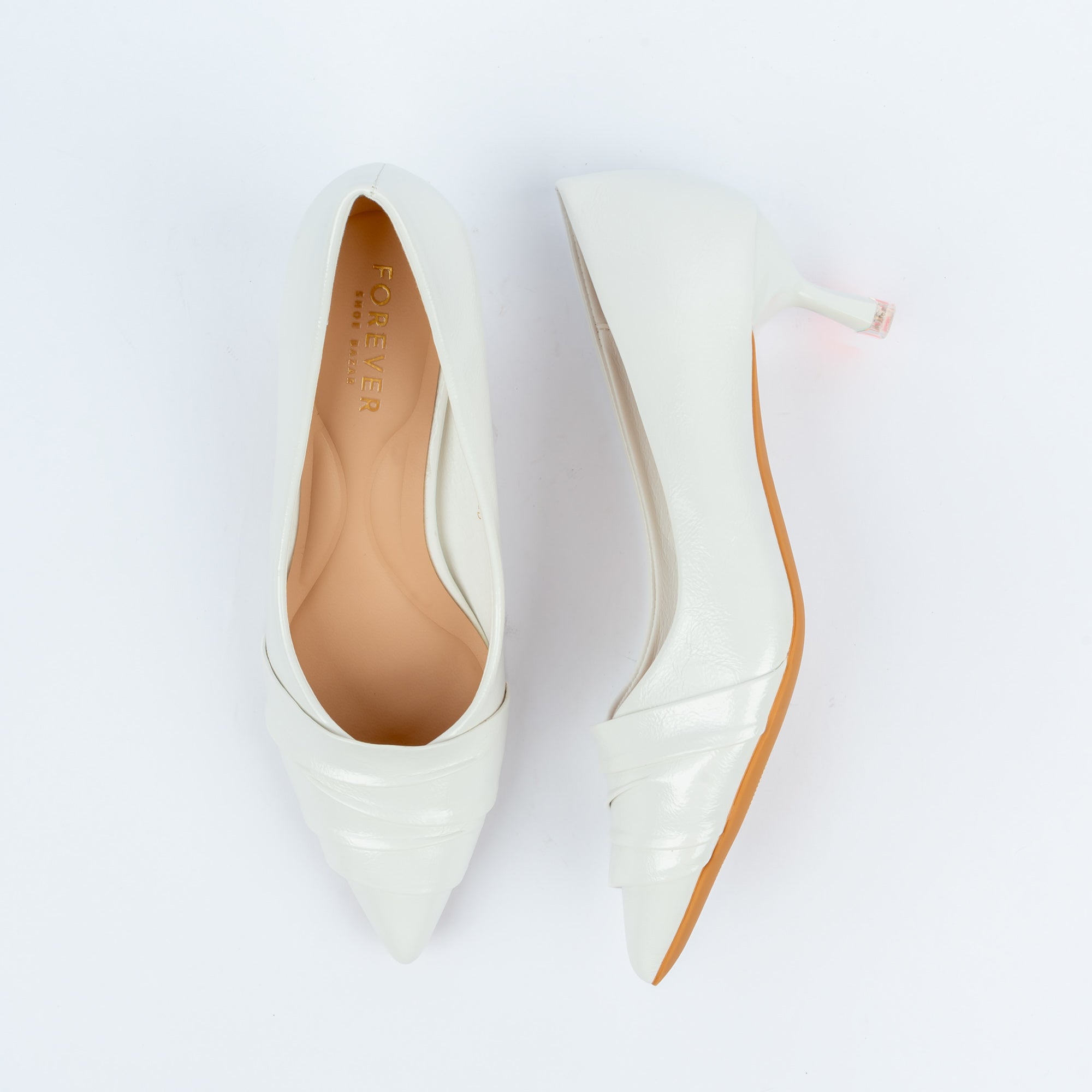White pumps for women, a softly pleated vamp panel folding into a sharp point, with a low V-cut throat and a flared kitten heel finished with a clear acrylic tip