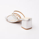 Silver criss cross strap mules for women with cushioned footbed, side view