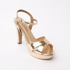 Gold snake print platform sandals styled for casual wear