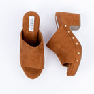 Tan platform heel mules for women, gold dome studs set around a chunky platform rand