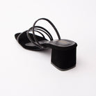 Black criss cross strap mules for women with cushioned footbed, side view