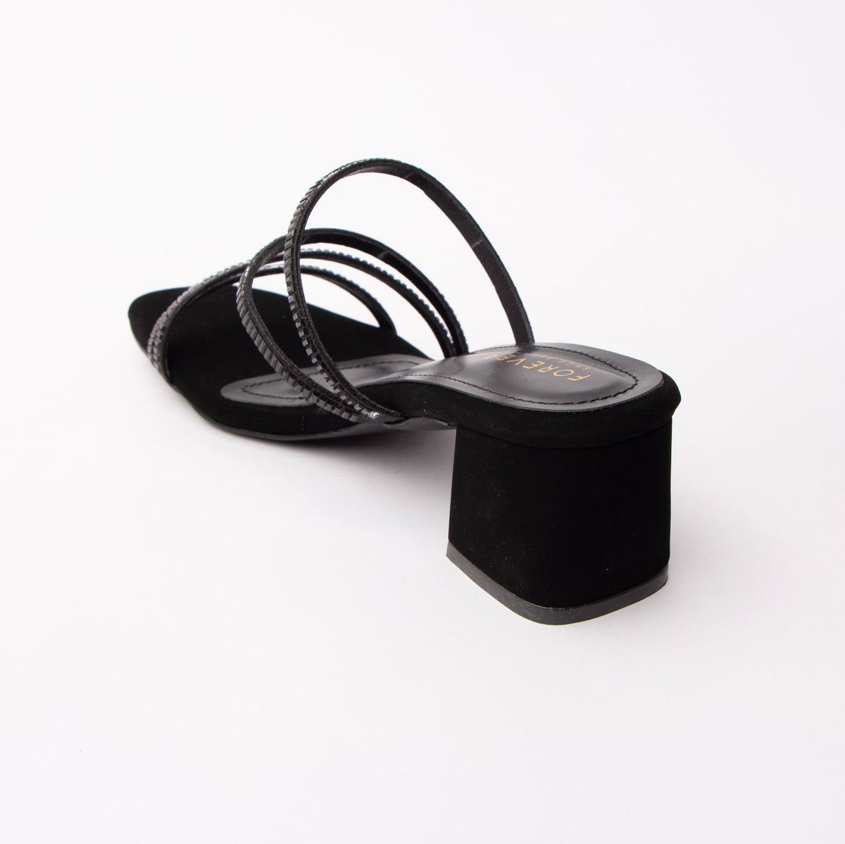 Black criss cross strap mules for women with cushioned footbed, side view