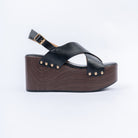 Black wedge heel sandals styled for casual wear