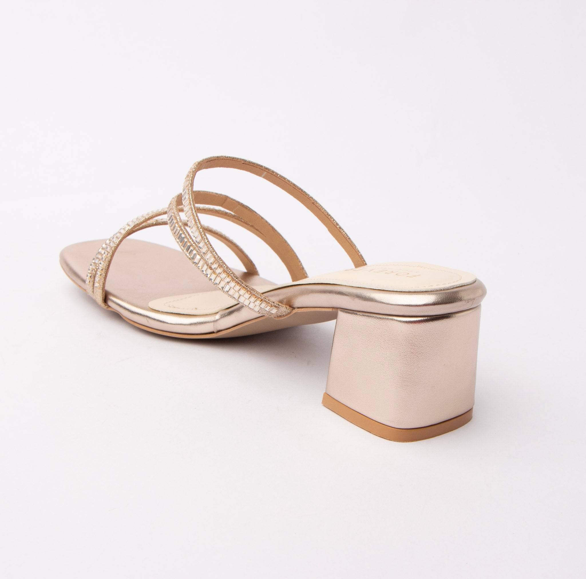Gold criss cross strap mules for women with cushioned footbed, side view