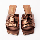 Bronze metallic mules styled for everyday wear
