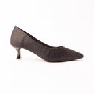 Black crystal kitten heel pumps for women, black satin paved with tiny jet crystals packed solid across the pointed toe and thinning to a loose scatter over the quarters, on a self-covered flared spool kitten heel with a clear tip and a nude padded footbed