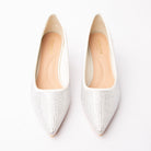 White crystal kitten heel pumps styled for a party
