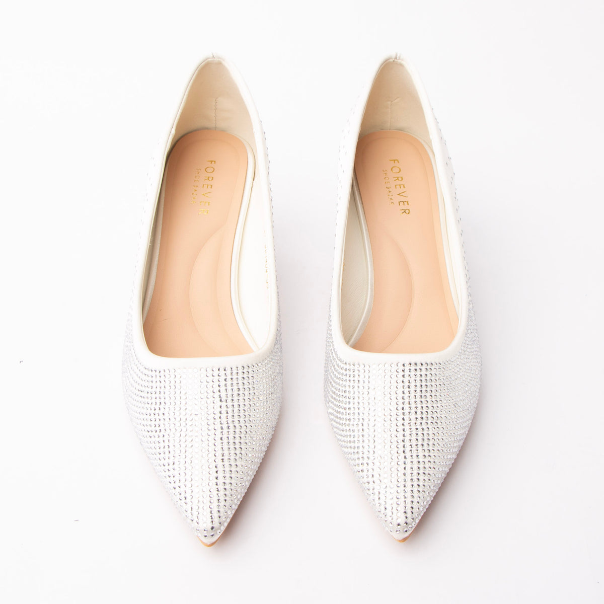 White crystal kitten heel pumps styled for a party