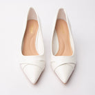 White folded strap pumps styled for everyday wear