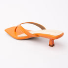 Orange toe-post kitten heel mules for women, back view showing the heel