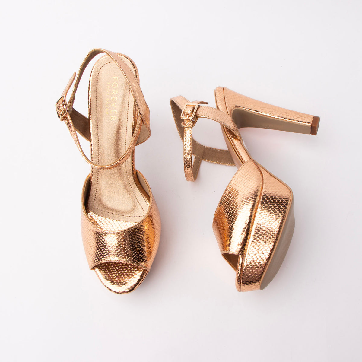 Champagne peep toe platform heels for women, warm rose-gold foiled snake-embossed leatherette formed into a single wide vamp band and a fine buckled ankle strap, set over a covered toe platform and flared block heel, with a champagne-gold footbed and a pale nude sole edge and heel tip