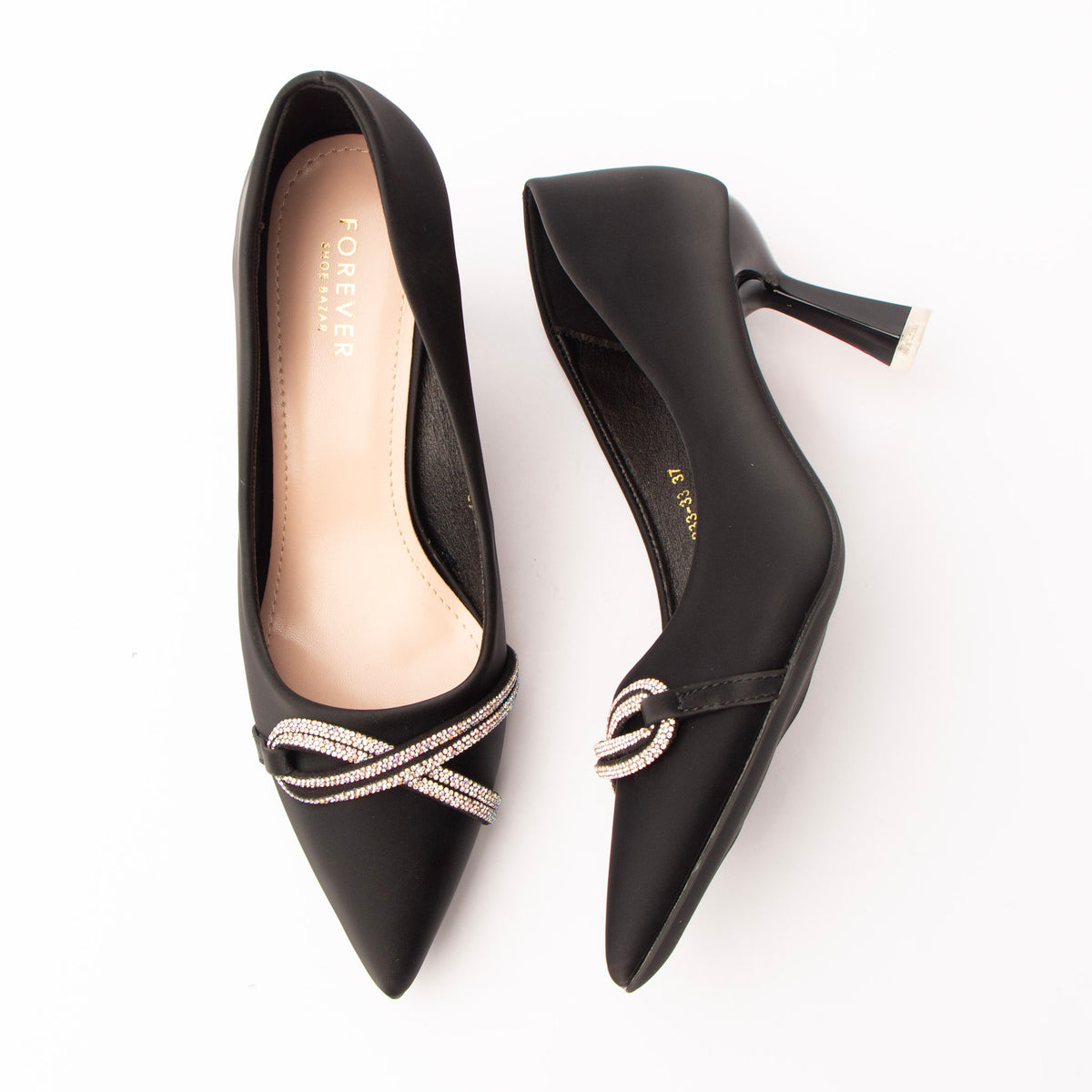 Black crystal court shoes for women, twin rows of silver rhinestones twist into a knotted loop across the vamp of a matte black satin pointed-toe court shoe, with no fastening, a nude padded footbed and a flared spool heel tipped in polished silver