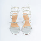 Silver block heel sandals for women, two crystal-paved bands across the forefoot feeding a rhinestone coil that spirals three times up the ankle, punctuated by tiny crystal butterflies