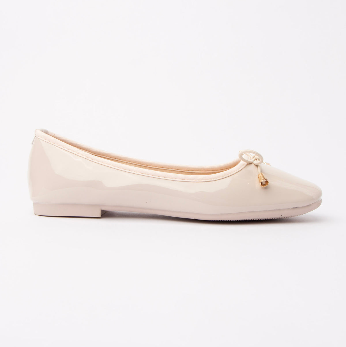 Cream patent ballerina flats for women, a soft ivory-cream patent ballerina with a gentle sheen, gathered cream binding around the entire topline and heel counter, and a fine cord bow tipped in gold